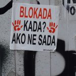 A sign on a wall that says blokada kada? ako ne